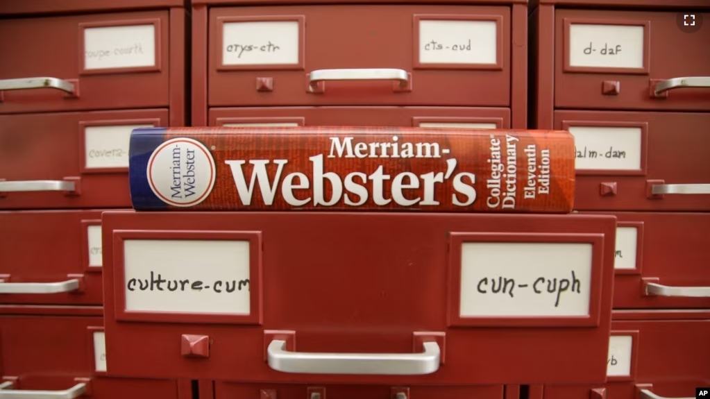 FILE - A Merriam-Webster dictionary sits atop their citation files at the dictionary publisher's offices on Dec. 9, 2014, in Springfield, Mass. Merriam-Webster's word of the year for 2023 is “authentic.” (AP Photo/Stephan Savoia, File)