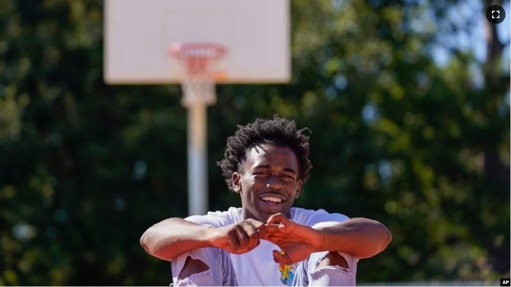 Bryant West poses for a portrait on a basketball court built by NBA star Devin Booker, who went to high school here, in Moss Point, Miss., Friday, Oct. 20, 2023. (AP Photo/Gerald Herbert)