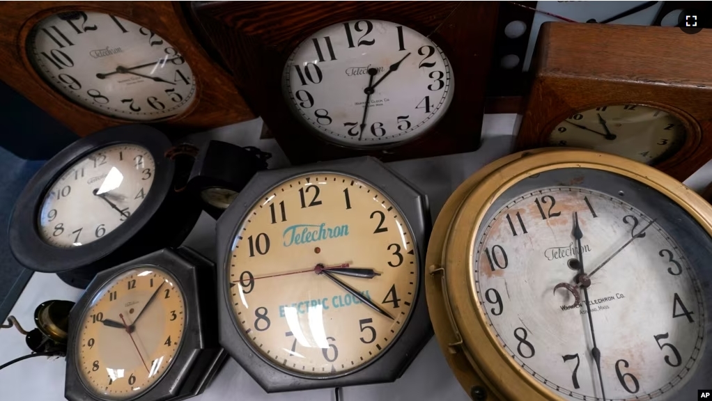 FILE - Clocks are displayed at Electric Time Company on Nov. 1, 2022, in Medfield, Massachusetts. (AP Photo/Charles Krupa)