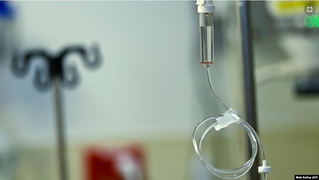 Saline fluid runs through a tube demonstrating how ketamine would be administered to a patient at the Duke Speciality Infusion Center on Friday, Oct. 27, 2023, in Durham, N.C. (AP Photo/Matt Kelley)