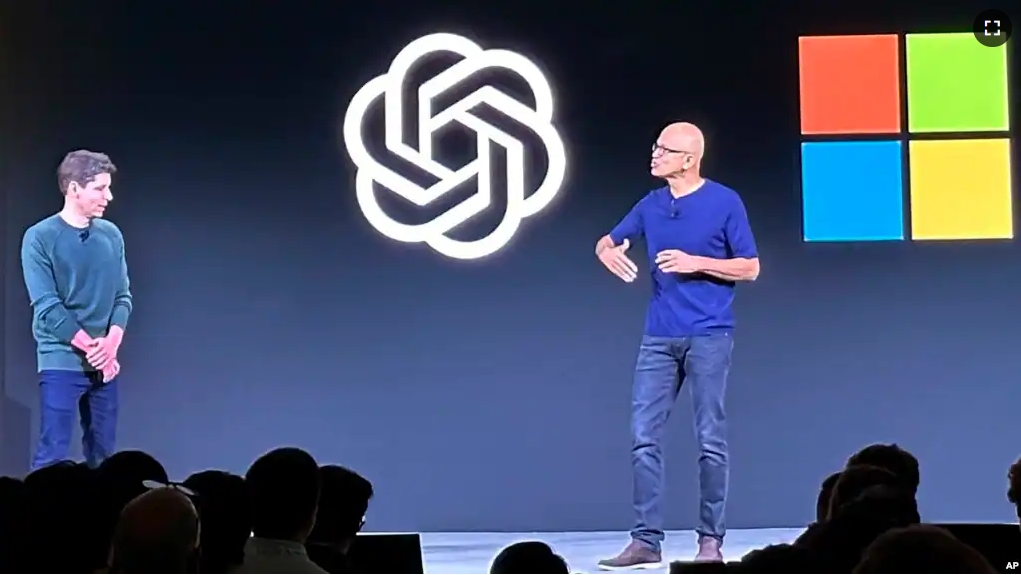 FILE - Sam Altman, left, appears onstage with Microsoft CEO Satya Nadella at OpenAI's first developer conference, on Nov. 6, 2023, in San Francisco. Microsoft hired Altman after his sudden departure from OpenAI. (AP Photo/Barbara Ortutay, File)