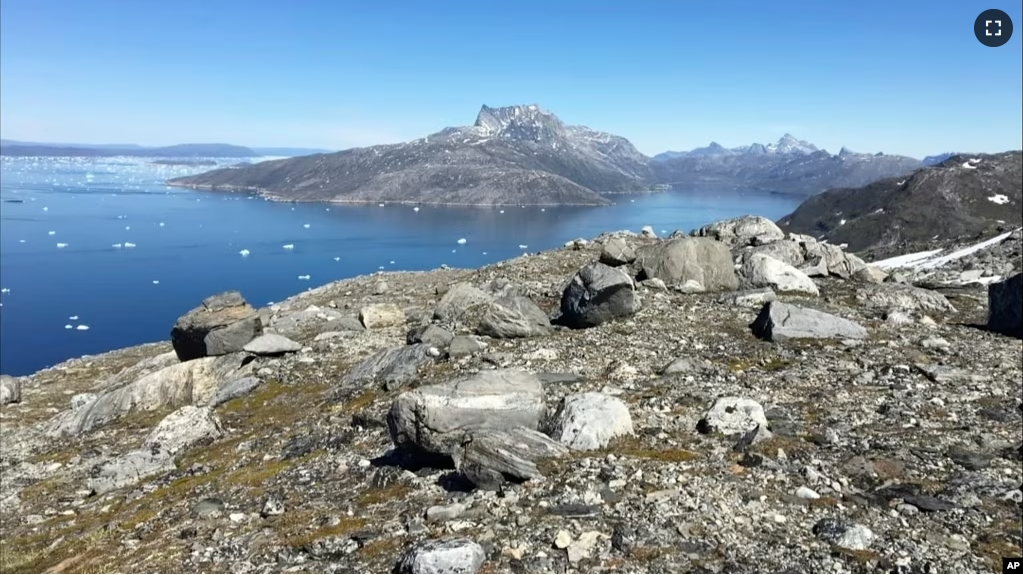 FILE - Small pieces of ice float in the water in Nuuk Fjord, Greenland, June 15, 2019. One of the world’s few rare earths processors outside China has bought exploration rights to mine in Greenland. (AP Photo/Keith Virgo, File)