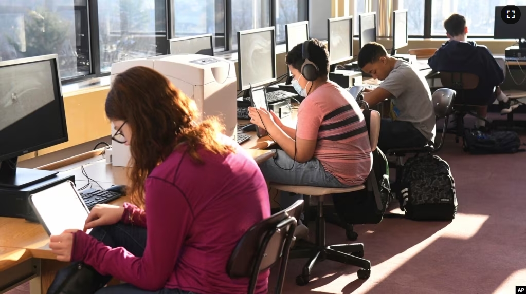 FILE - Students work in the library during homeroom at D.H.H. Lengel Middle School in Pottsville, Pa., March 15, 2022. (Lindsey Shuey/Republican-Herald via AP, File)