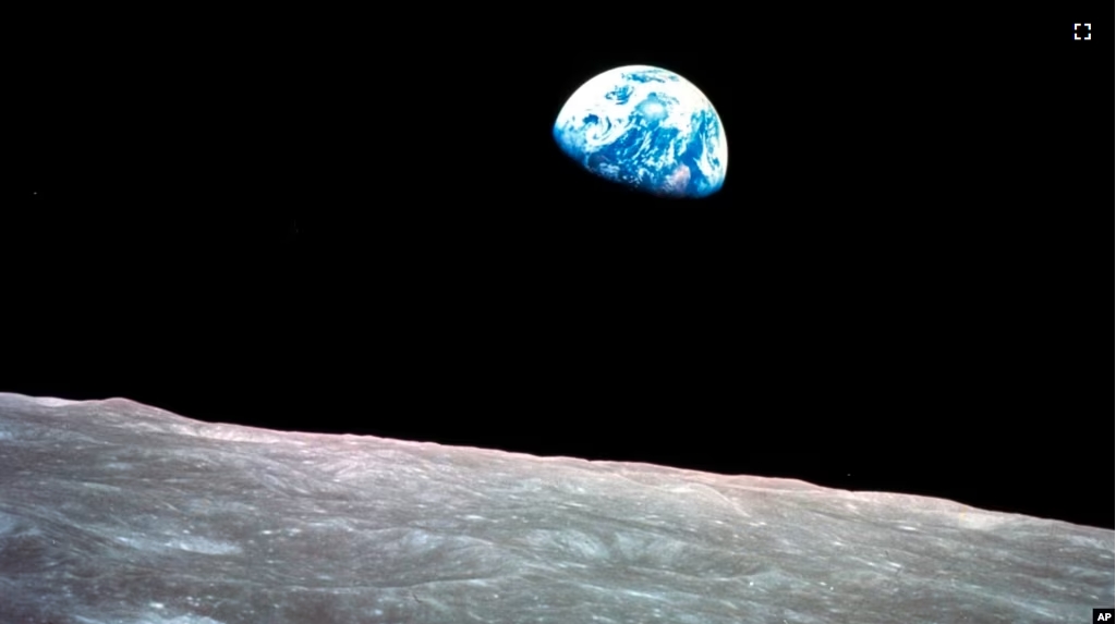 FILE - This Dec. 24, 1968, file photo made available by NASA shows the Earth behind the surface of the moon during the Apollo 8 mission. (William Anders/NASA via AP, File)