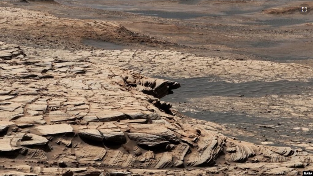 This photo, compiled from 28 images, shows the view from NASA’s Curiosity Mars rover on April 9, 2020. It shows the landscape of the Stimson sandstone formation in Gale Crater. (Photo Credit: NASA/JPL-Caltech/MSSS)