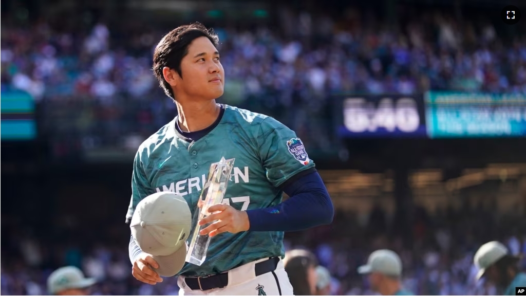 FILE - Japan's Shohei Ohtani, of the Los Angeles Angels acknowledges the crowd after receiving the trophy for leading vote-getter during the MLB All-Star baseball game in Seattle, Tuesday, July 11, 2023. (AP Photo/Lindsey Wasson)