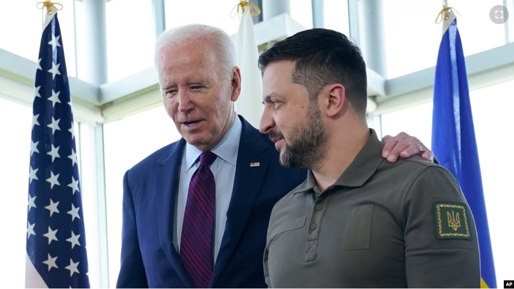 FILE - President Joe Biden, left, walks with Ukrainian President Volodymyr Zelenskyy ahead of a working session on Ukraine during the G7 Summit in Hiroshima, Japan, Sunday, May 21, 2023. (AP Photo/Susan Walsh, Pool, File)