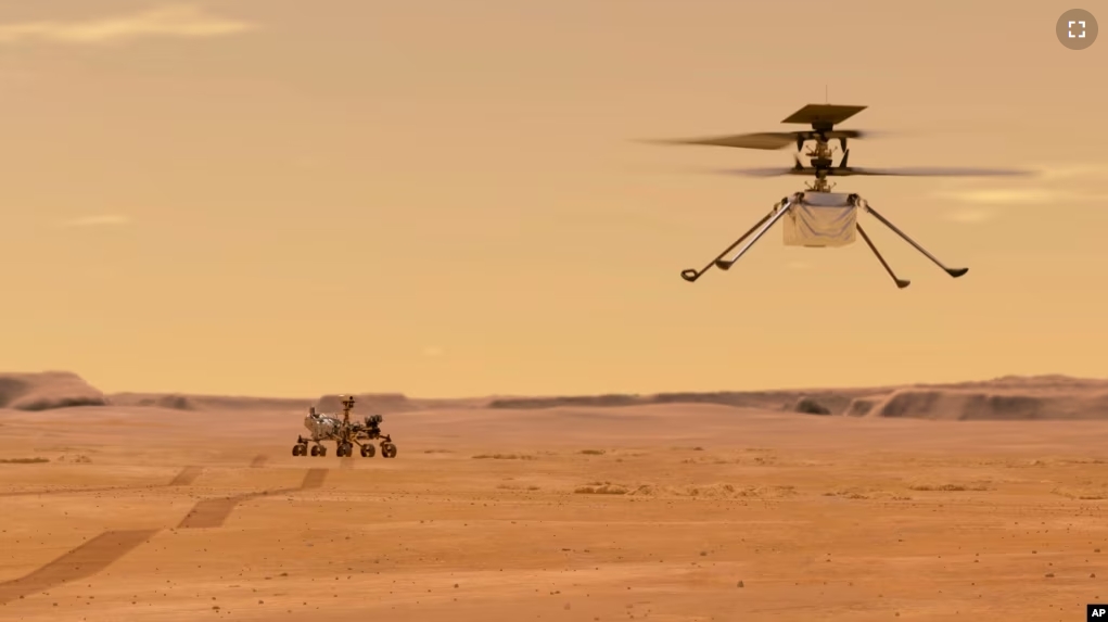 This illustration, made available by NASA, depicts the Ingenuity helicopter on Mars after launching from the Perseverance rover, shown in the background left. (NASA/JPL-Caltech via AP)