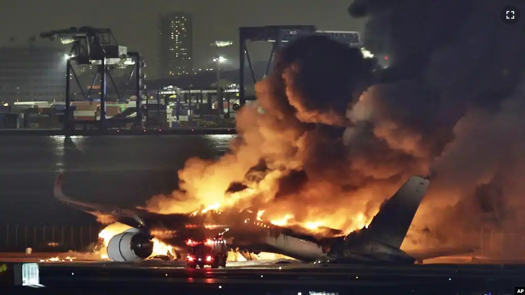 A Japan Airlines plane is on fire on the runway of Haneda airport on Tuesday, Jan. 2, 2024 in Tokyo, Japan.