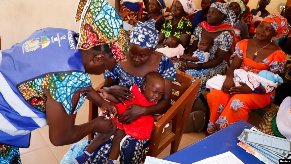 A nurse administers a malaria vaccine to an infant at the health center in Datcheka, Cameroon January 22, 2024. (REUTERS/Desire Danga Essigue)