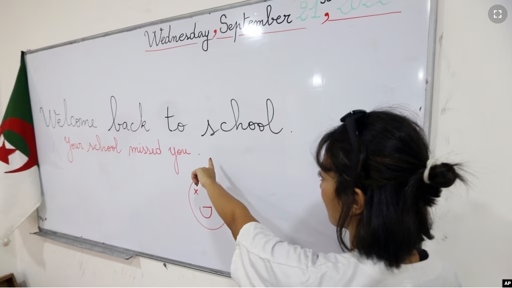 FILE - A teacher gives an English lesson in a private school of Birkhadem, outside Algiers, Wednesday, Sept.21, 2022. English proficiency in Algeria has remained stable since 2021. (AP Photo/Fateh Guidoum)