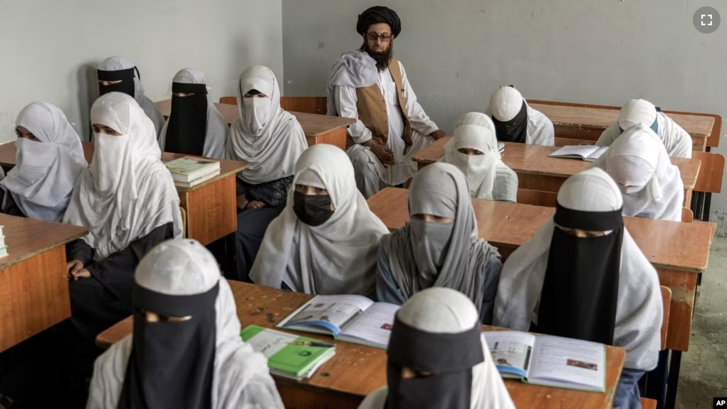 FILE - Afghan girls attend a religious school, which remained open since the last year's Taliban takeover, in Kabul, Afghanistan, on Aug. 11, 2022. (AP Photo/Ebrahim Noroozi, File)