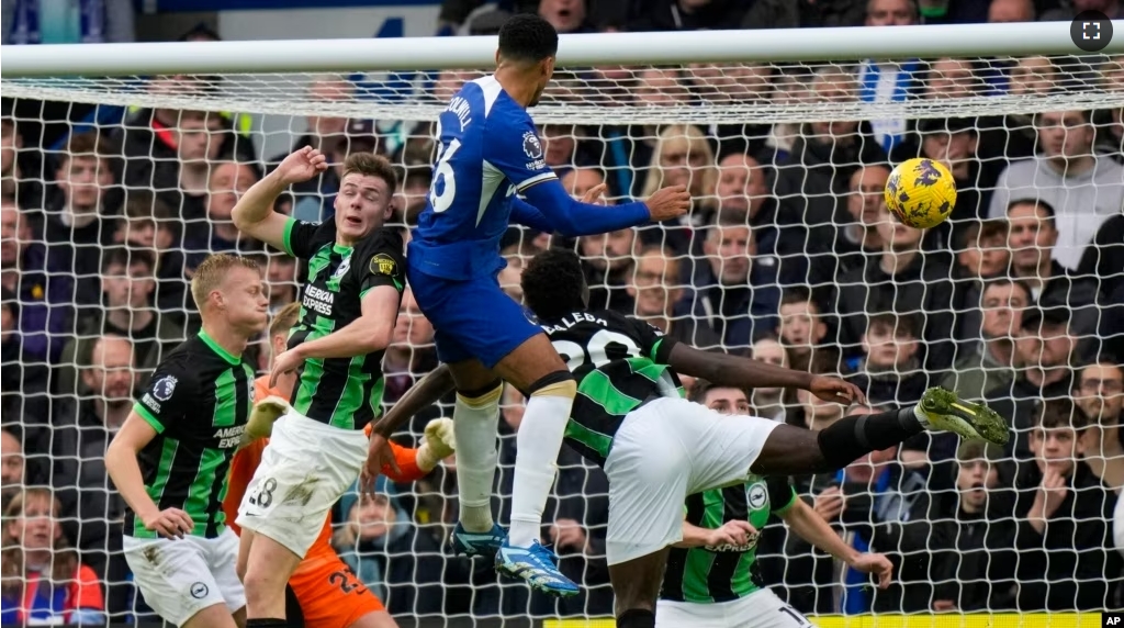 FILE - Chelsea's Levi Colwill, top center, scores a goal during a soccer match between Chelsea and Brighton and Hove Albion, at Stamford Bridge stadium in London on Dec. 3, 2023. (AP Photo/Alastair Grant)