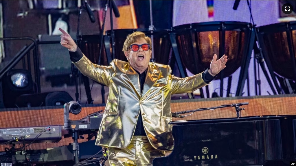 FILE - Elton John performs during Glastonbury Festival in Worthy Farm, Somerset, England, Sunday, June 25, 2023. (Joel C Ryan/Invision/AP)