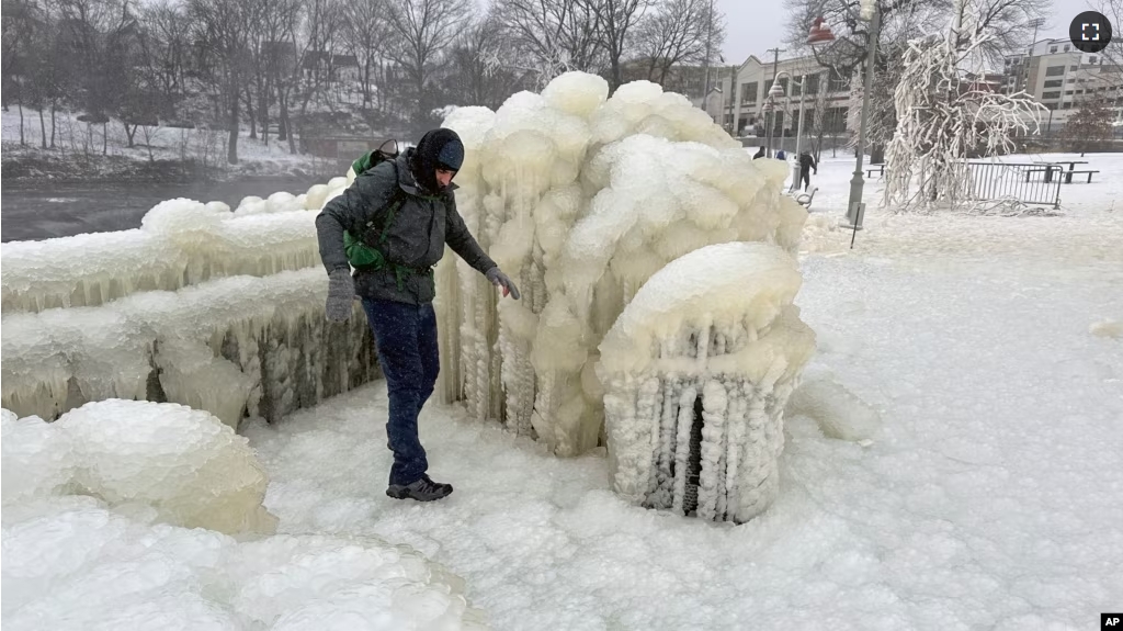 FILE - Mist from the Great Falls has created a frozen wonderland around the waterfalls in Paterson, New Jersey, Jan. 18, 2024. (AP Photo/Ted Shaffrey)