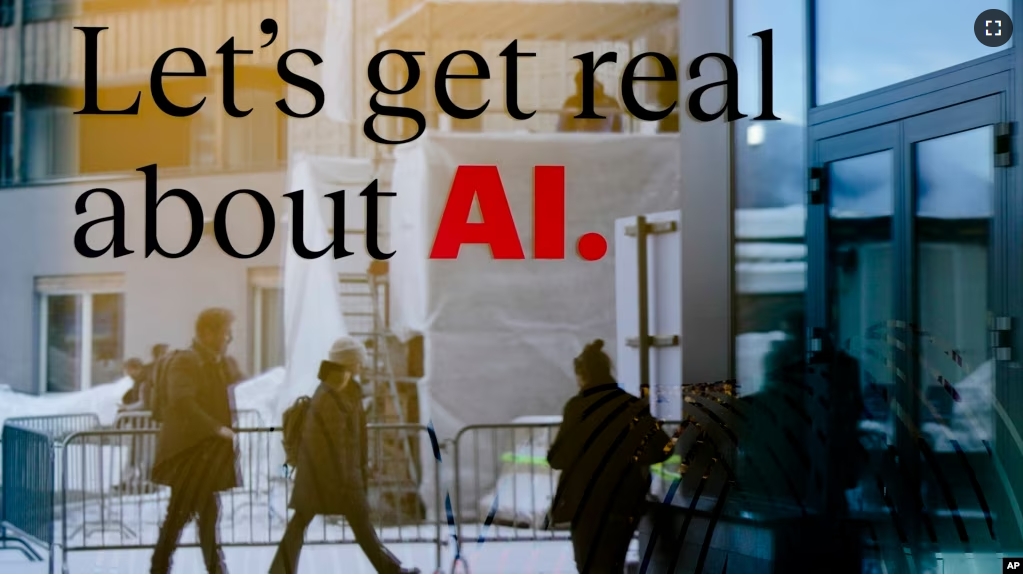 People reflected in a window of a hotel at the Davos Promenade with a slogan about AI alongside the World Economic Forum in Davos, Switzerland, Monday, Jan. 15, 2024. (AP Photo/Markus Schreiber)