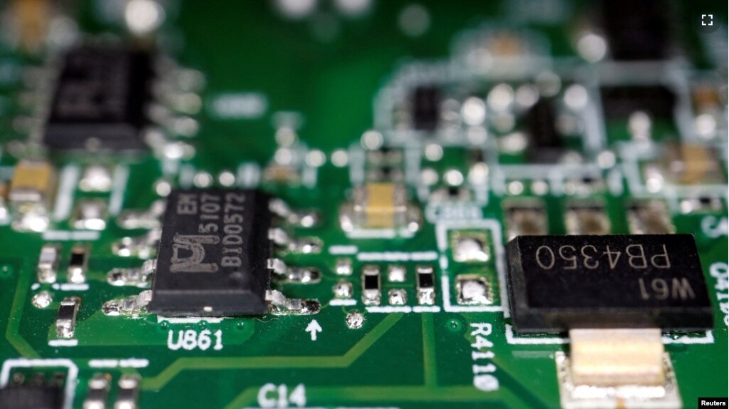 FILE - Semiconductor chips are seen on a printed circuit board in this illustration picture taken February 17, 2023. (REUTERS/Florence Lo/Illustration//File Photo)