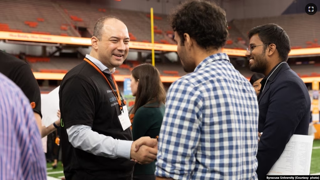 Students interact with industry representatives during a career event at Syracuse University. (Photo courtesy of Syracuse University)