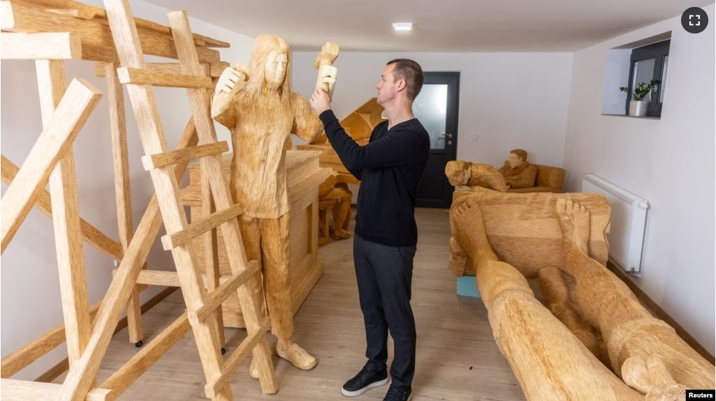 Tomislav Horvat, 34, inspects a new sculpture of Michelangelo made of matches in Domasinec, Croatia, January 17, 2024. For the last six years, Horvat has been working on the sculpture of Michelangelo and David which will be made of around 430,000 matches. (REUTERS/Antonio Bronic)