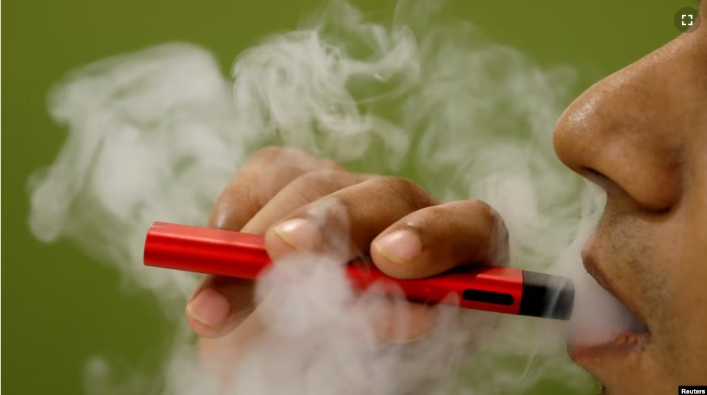 FILE - A man uses a vape device in this illustration picture, September 19, 2019. (REUTERS/Adnan Abisi/Illustration)