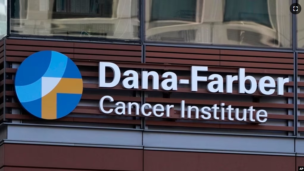 FILE - A sign hangs from the Dana-Farber Cancer Institute, Aug. 18, 2022, in Boston. (AP Photo/Charles Krupa, File)