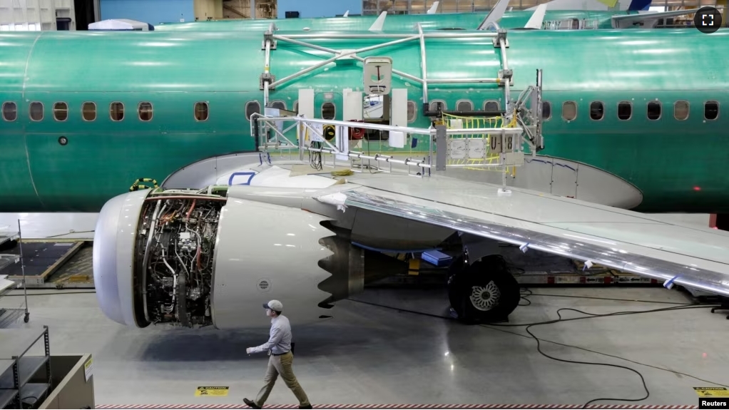 FILE - A worker walks past Boeing's new 737 MAX-9 under construction at their production facility in Renton, Washington on February 13, 2017. (REUTERS/Jason Redmond/File Photo)