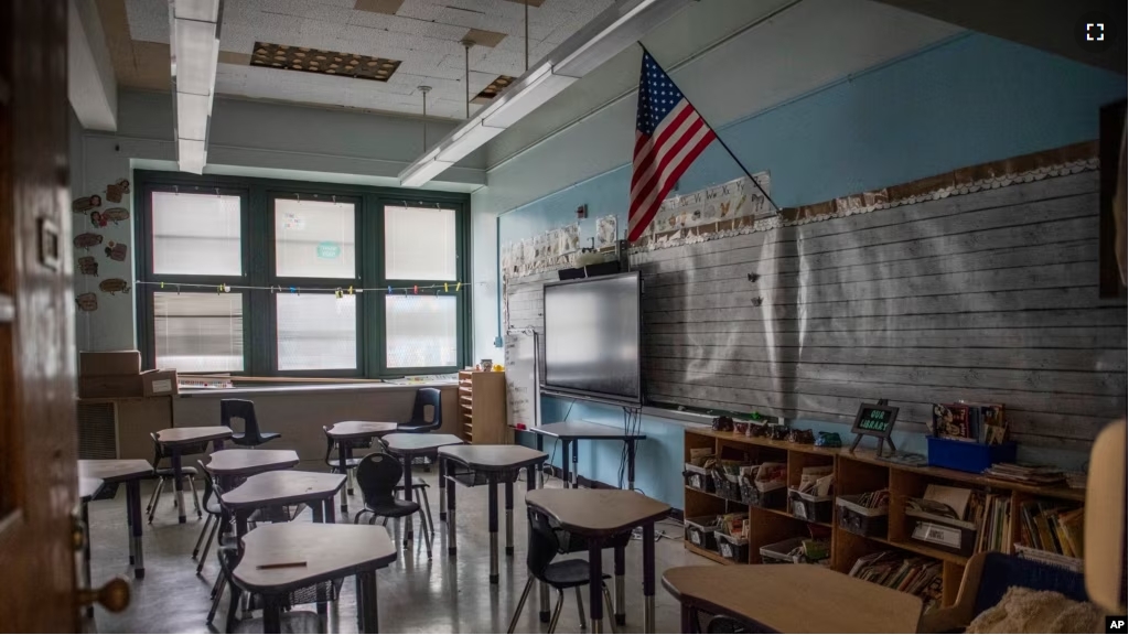 FILE - An empty elementary school classroom is seen on Tuesday, Aug. 17, 2021 in the Bronx borough of New York. (AP Photo/Brittainy Newman, File)