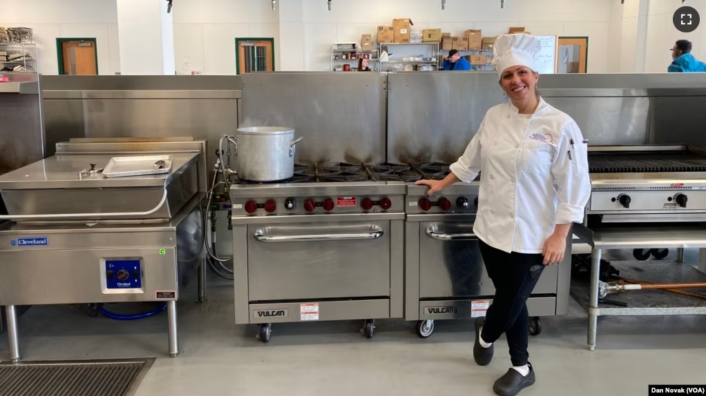 Clarissa Haglid, a graduate of the culinary school at the Delaware Food Bank, in the food bank's kitchen on February 7, 2024. Haglid received an apprenticeship at a nearby hotel following her completion of the program. (Dan Novak/VOA)