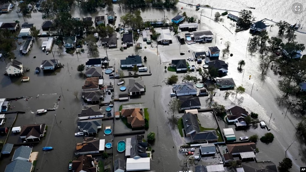 FILE - Homes are flooded in the aftermath of Hurricane Ida, Monday, Aug. 30, 2021, in Jean Lafitte, Louisiana. (AP Photo/David J. Phillip, File)