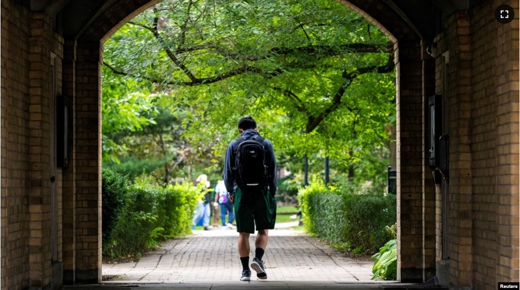 FILE - People walk on the grounds of the University of Toronto in Toronto, Ontario, Canada September 9, 2020. (REUTERS/Carlos Osorio/File Photo)