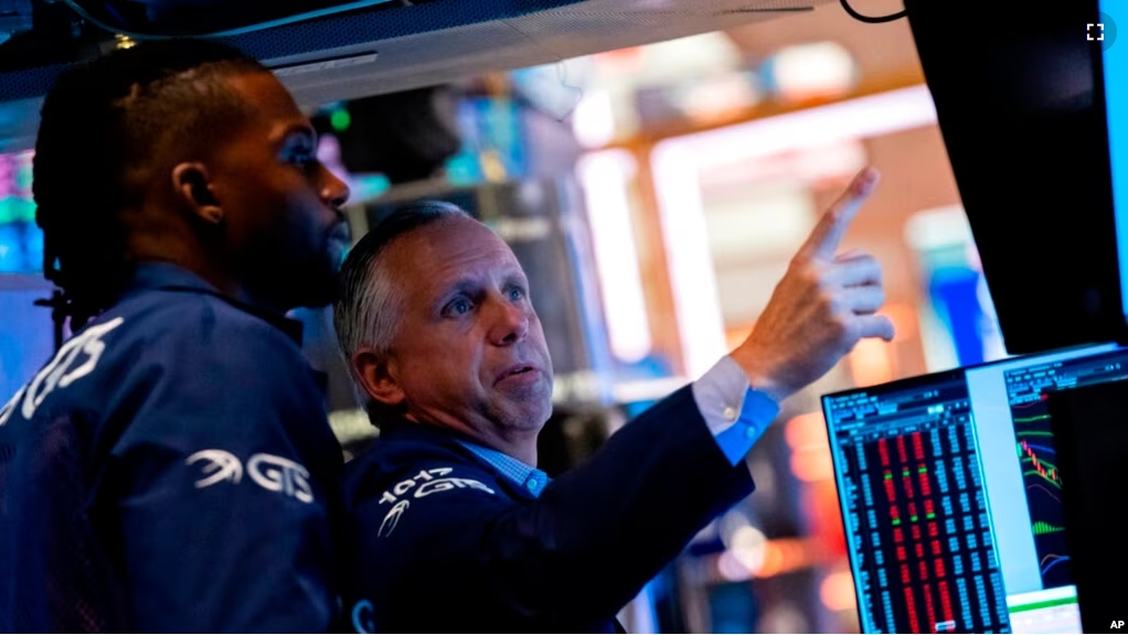 FILE - Traders work on the New York Stock Exchange floor, Sept. 13, 2022. (AP Photo/Julia Nikhinson)