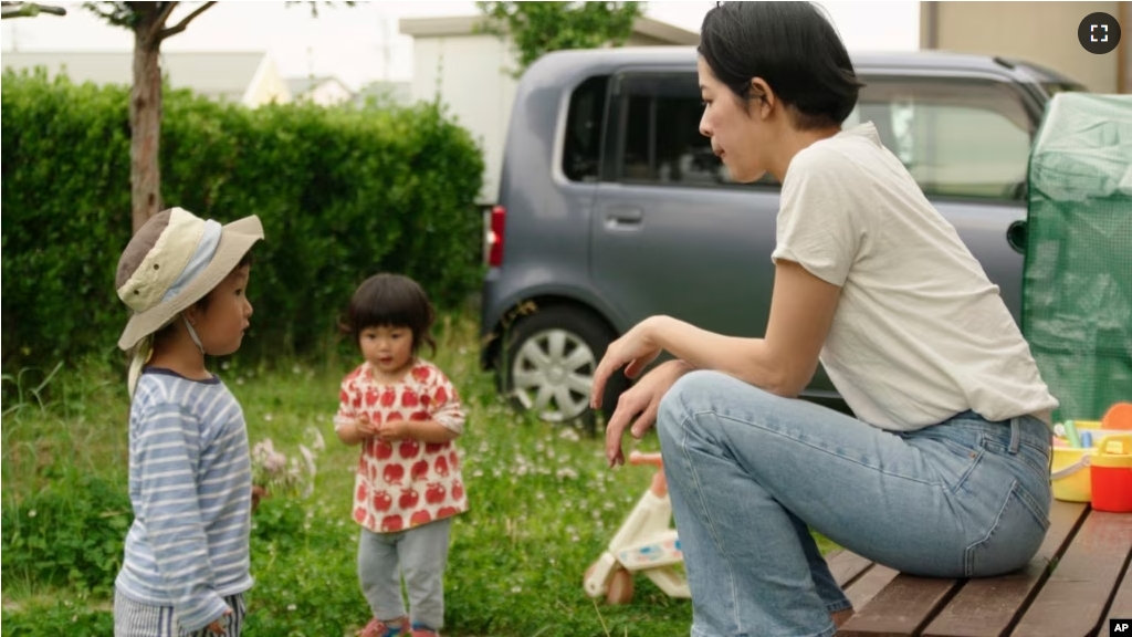 This photo provided by Japan Media Services shows a scene from The Ones Left Behind: The Plight of Single Mothers in Japan, directed by Rionne McAvoy.