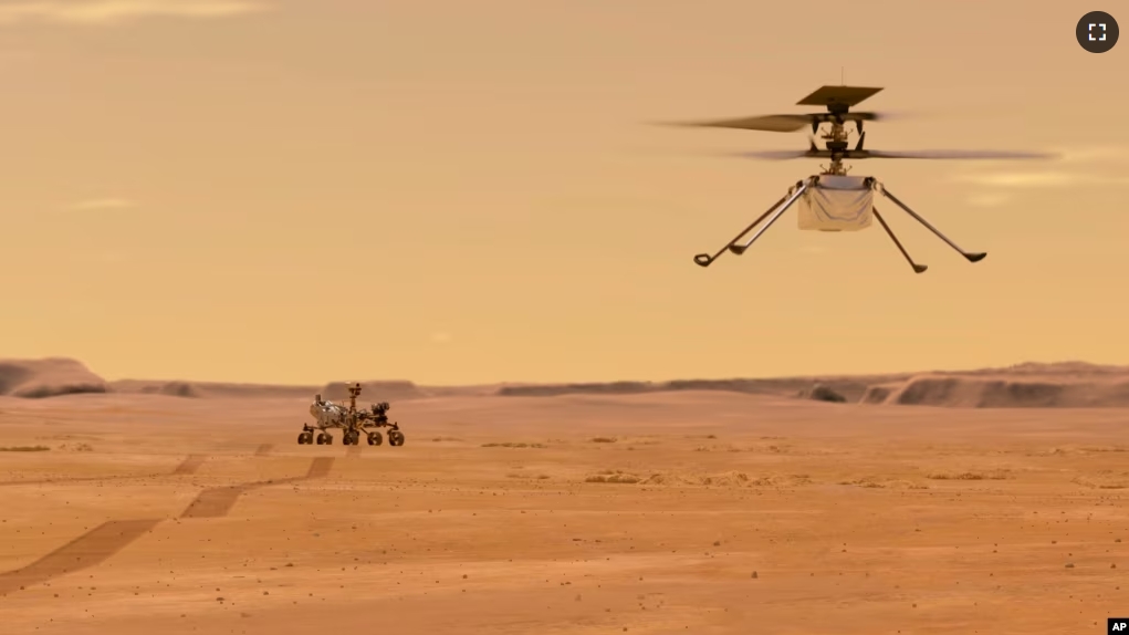 This illustration, made available by NASA, depicts the Ingenuity helicopter on Mars after launching from the Perseverance rover, shown in the background left. (NASA/JPL-Caltech via AP)