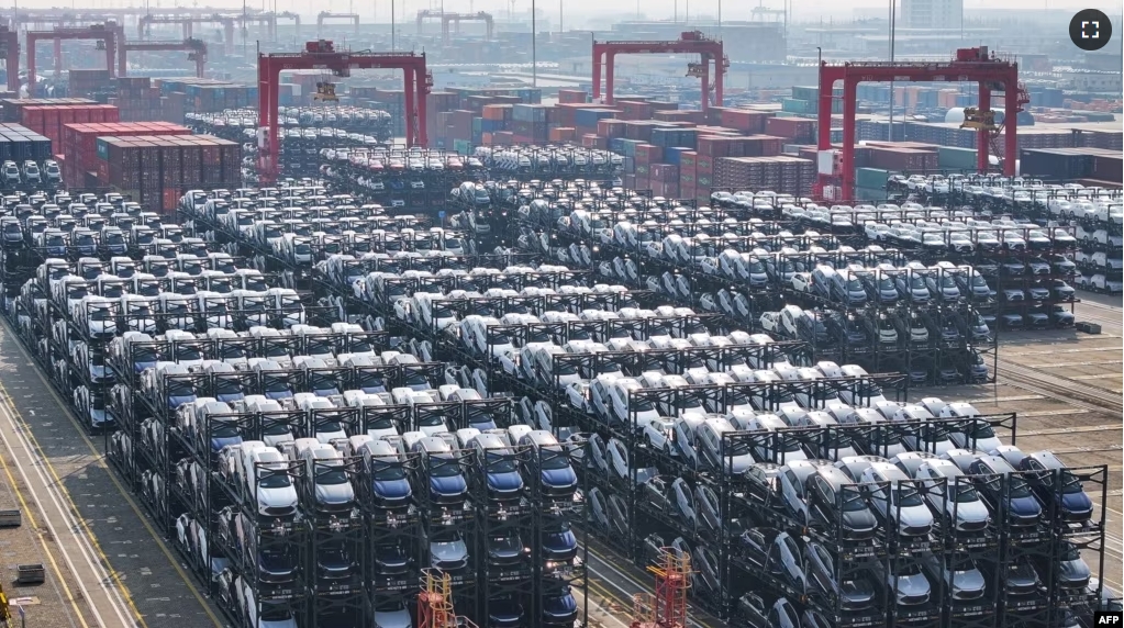 FILE - BYD electric cars waiting to be loaded onto a ship are seen stacked at the international container terminal of Taicang Port in Suzhou, in China’s eastern Jiangsu province on February 8, 2024. (Photo by AFP)