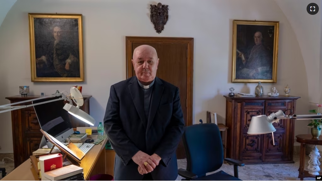 Prefect of the Archivio Apostolico Vaticano, Bishop Sergio Pagano poses in his office at The Vatican, Wednesday, Feb. 14, 2024, after an interview with The Associated Press. (AP Photo/Domenico Stinellis)