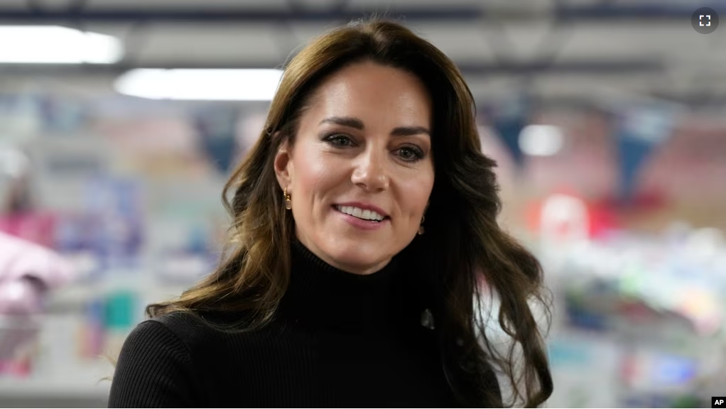 FILE - Britain's Kate, Princess of Wales smiles during her visit to Sebby's Corner in north London, Friday, Nov. 24, 2023. Princess Kate apologized Monday for “confusion” caused by her editing of a family photo released by the palace. (AP Photo/Frank Augstein, Pool, File )