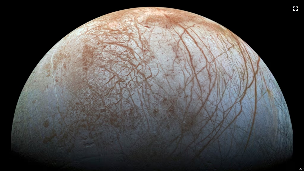 This image made available by NASA in 2014 shows Jupiter's icy moon Europa in a reprocessed color view, made from images captured by NASA's Galileo spacecraft in the late 1990s. (NASA/JPL-Caltech/SETI Institute via AP)