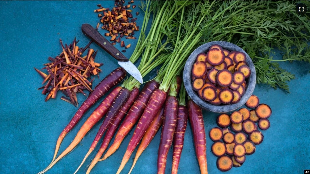 This image provided by Baker Creek Heirloom Seed Co. shows Lila Lu Sang carrots, which are deep purple on the outside and bright orange on the inside. (Baker Creek Heirloom Seed Co./rareseeds.com via AP)