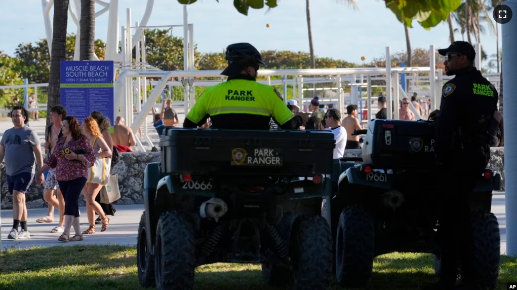 Miami Beach park rangers watch over crowds Tuesday, Feb. 27, 2024, in Miami Beach, Fla. (AP Photo/Marta Lavandier)