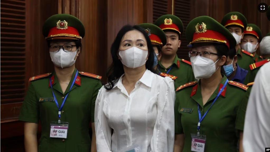 Vietnamese real estate tycoon Truong My Lan, front center, is escorted into a courtroom in Ho Chi Minh city, Vietnam, Tuesday, March 5, 2024. (Phan Thanh Vu/VNA via AP)