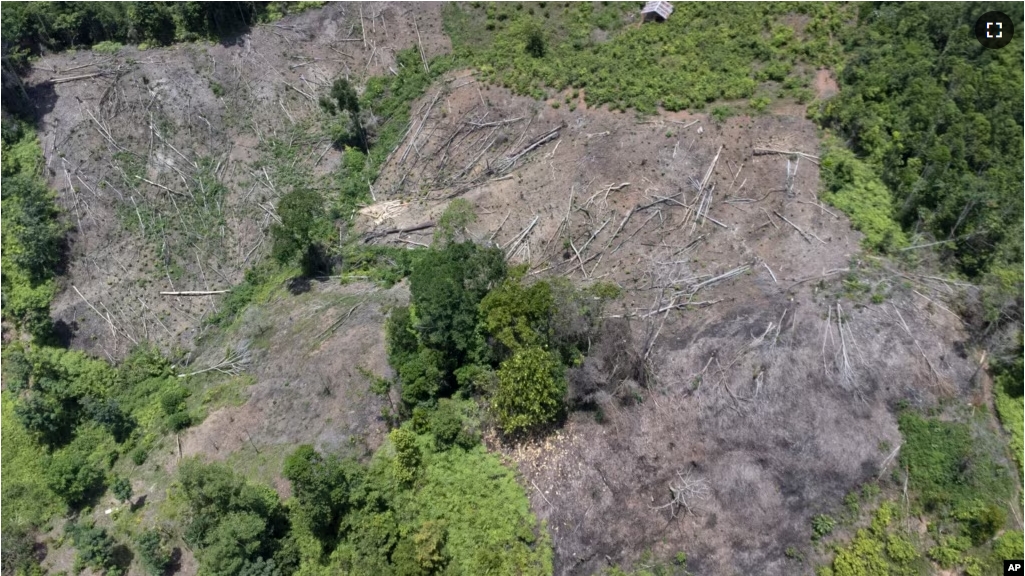 A deforested hill is visible near an area affected by a flash flood in Pesisir Selatan, West Sumatra, Indonesia, Thursday, March 14, 2024. (AP Photo/Sutan Malik Kayo)