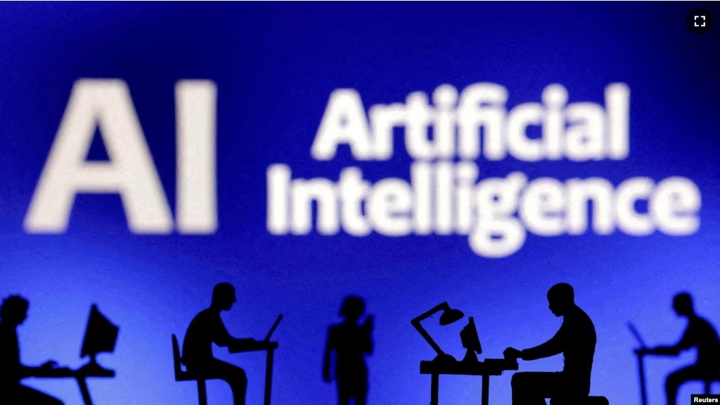 FILE - Figurines with computers and smartphones are seen in front of the words "Artificial Intelligence AI" in this illustration taken, February 19, 2024. (REUTERS/Dado Ruvic/Illustration/File Photo)