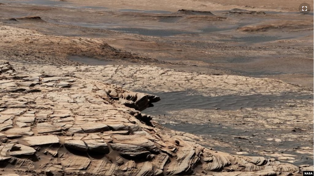 This photo, compiled from 28 images, shows the view from NASA’s Curiosity Mars rover on April 9, 2020. It shows the landscape of the Stimson sandstone formation in Gale Crater. (Photo Credit: NASA/JPL-Caltech/MSSS)