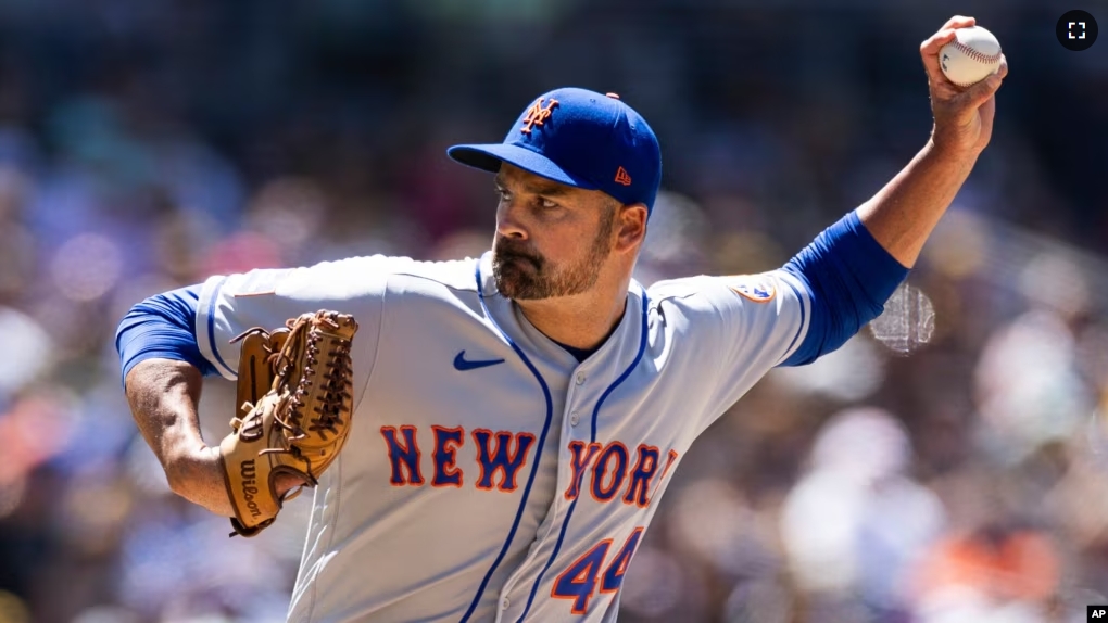 FILE - New York Mets' T.J. McFarland (a left-hander) winds up against the San Diego Padres in the sixth inning of a baseball game Sunday, July 9, 2023, in San Diego.(AP Photo/Derrick Tuskan, File)