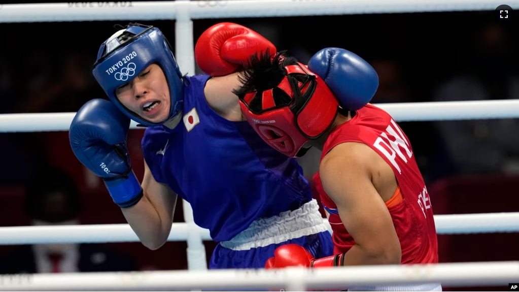 FILE - Philippines's Nesthy Petecio, right, exchanges punches with Japan's Sena Irie at the 2020 Summer Olympics, Tuesday, Aug. 3, 2021, in Tokyo, Japan. (AP Photo/Themba Hadebe)