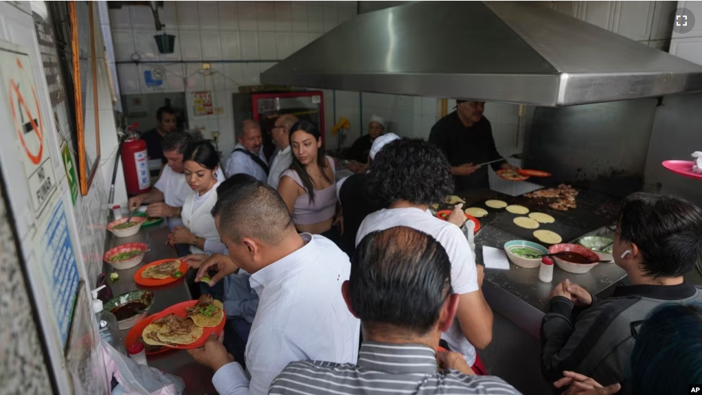 An overhead view of the Tacos El Califa de León taco stand, in Mexico City, Wednesday, May 15, 2024. Tacos El Califa de León is the first ever taco stand to receive a Michelin star from the French dining guide. (AP Photo/Fernando Llano)