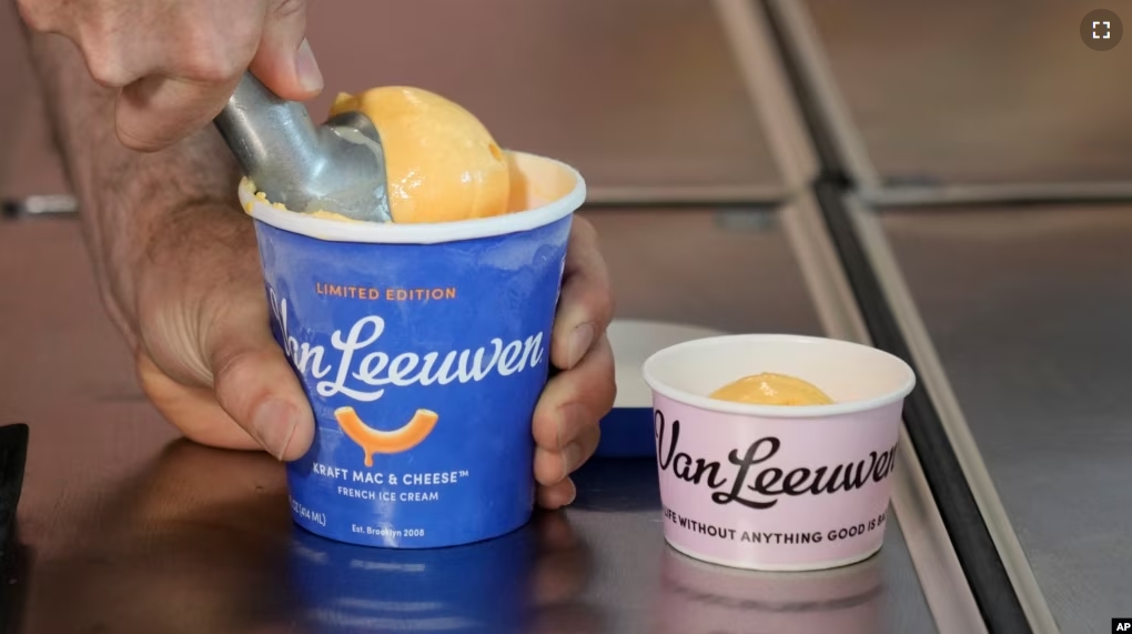 Ben Van Leeuwen scoops Kraft Mac & Cheese flavored ice cream Wednesday, May 15, 2024, in the Brooklyn borough of New York. (AP Photo/Frank Franklin II)