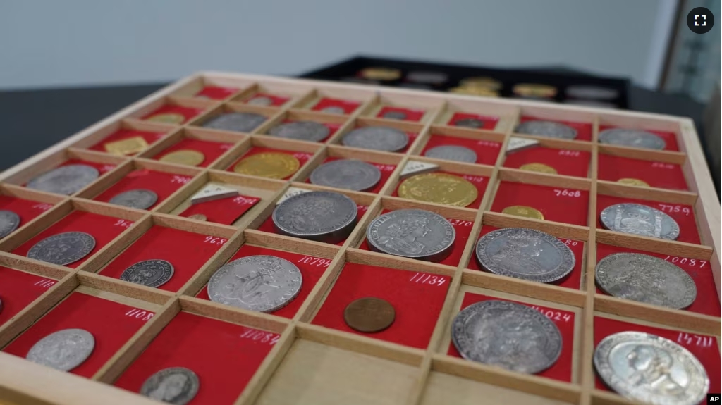 Coins from L. E. Bruun's collection on display on a wooden tray, in Zealand, Denmark, May 7, 2024. The large collection could get up to $72 million. (AP Photo/James Brooks)