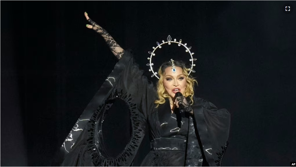 Madonna performs in the final show of her The Celebration Tour, on Copacabana Beach in Rio de Janeiro, Brazil, Saturday, May 4, 2024. (AP Photo/Silvia Izquierdo)