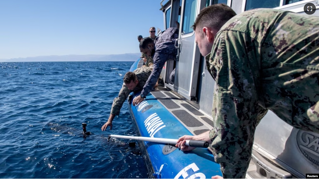 FILE - Sailors from Jordan and other nations retrieve an unmanned undersea drone during a military exercise in the Gulf of Aqaba, Jordan, on February 8, 2022 (U.S. Naval Forces Central Command/2nd Class Dawson Roth/Handout via REUTERS)